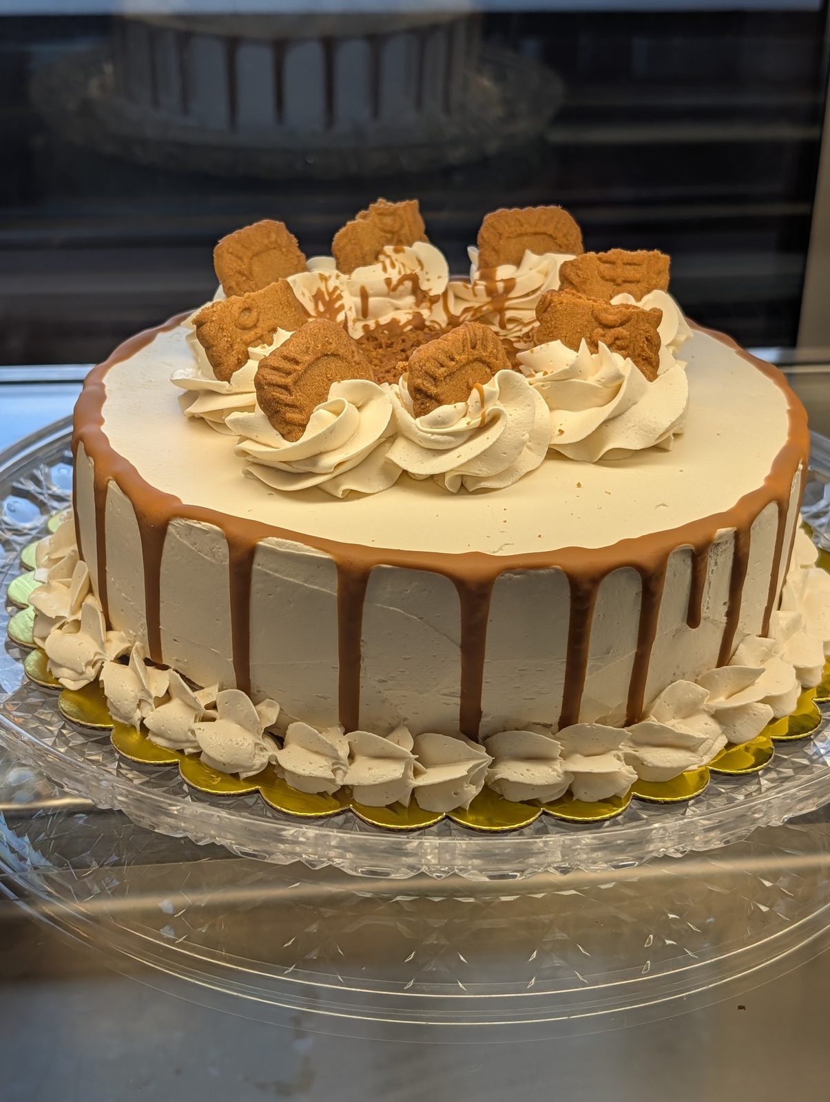 Cookie butter layer cake with caramel drip from the dessert case