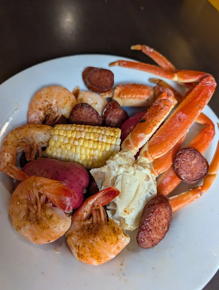 Seafood boil with crab legs, shrimp, sausage, corn and red potatoes