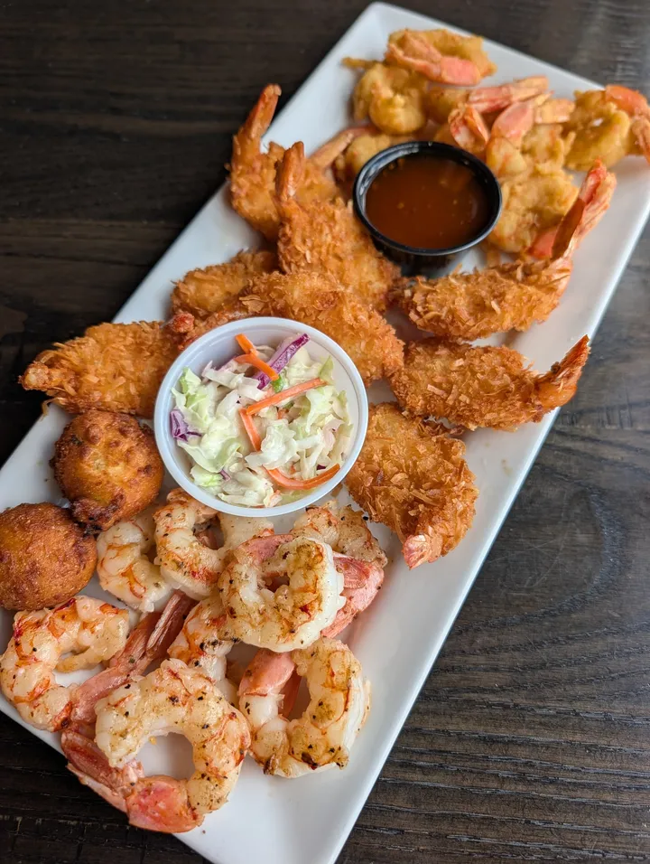 Shrimp prepared several ways, with coleslaw, hush puppies and dipping sauce