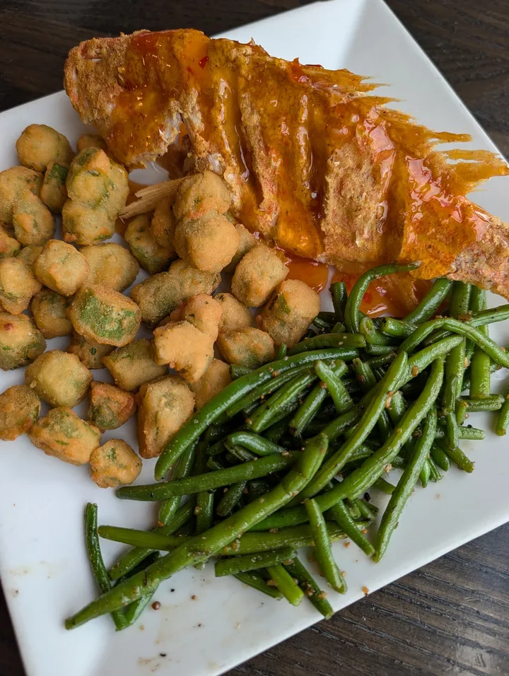 Whole fried fish with sauce, fried okra and green beans